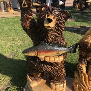 Welcome Waving Bear with fish Sign